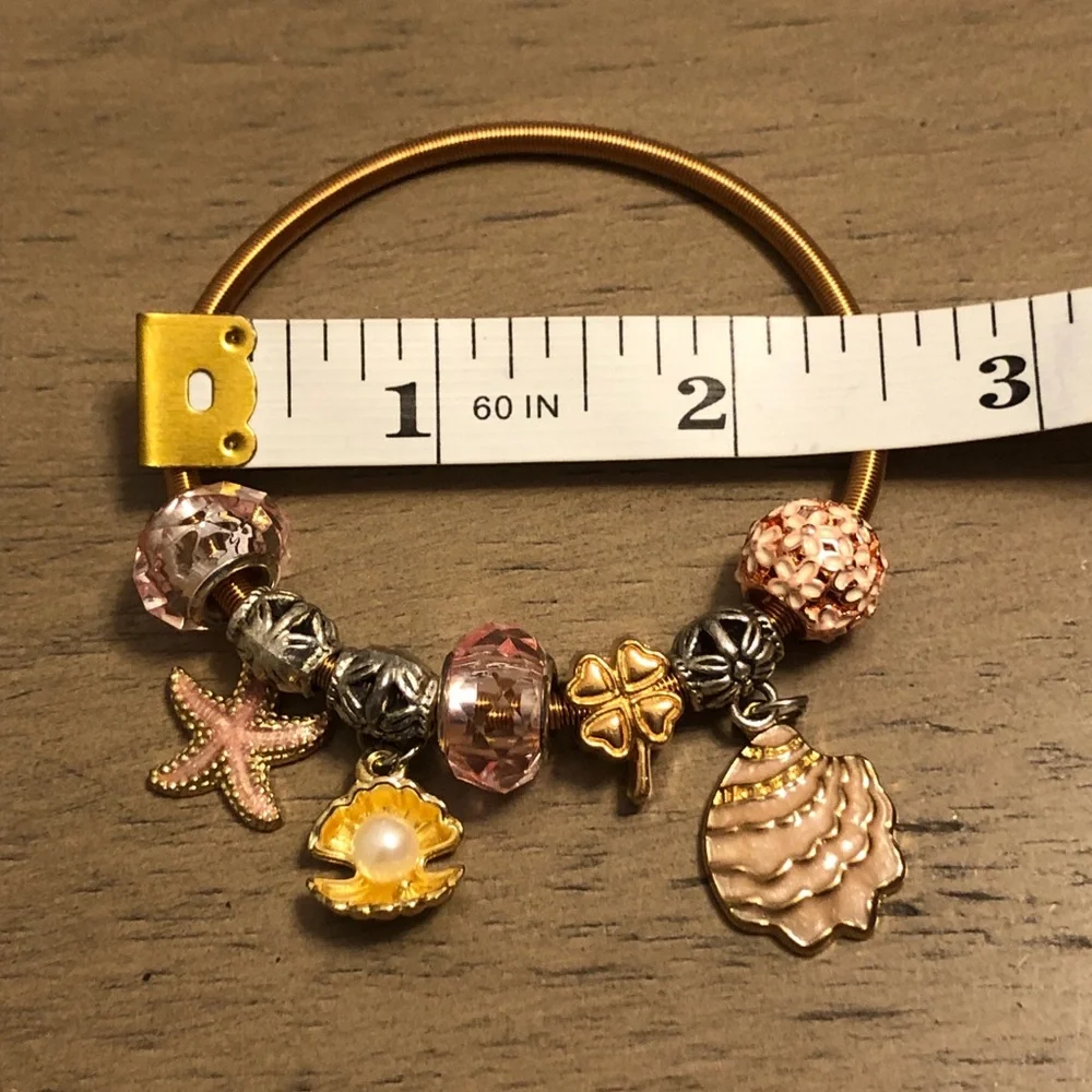 Elegant Gold Tone and Pink Stretchy Beach Theme Charm Bracelet